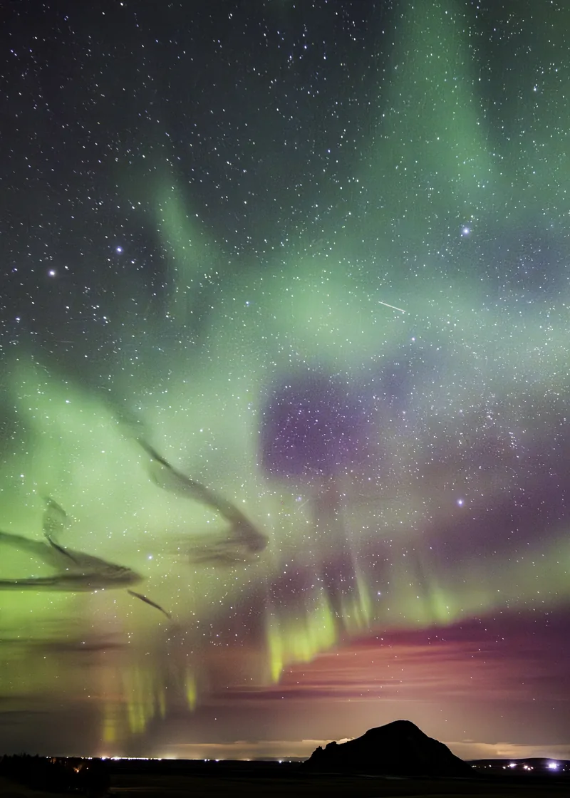 Green ribbons of aurora and stars above Eyvindarholt
